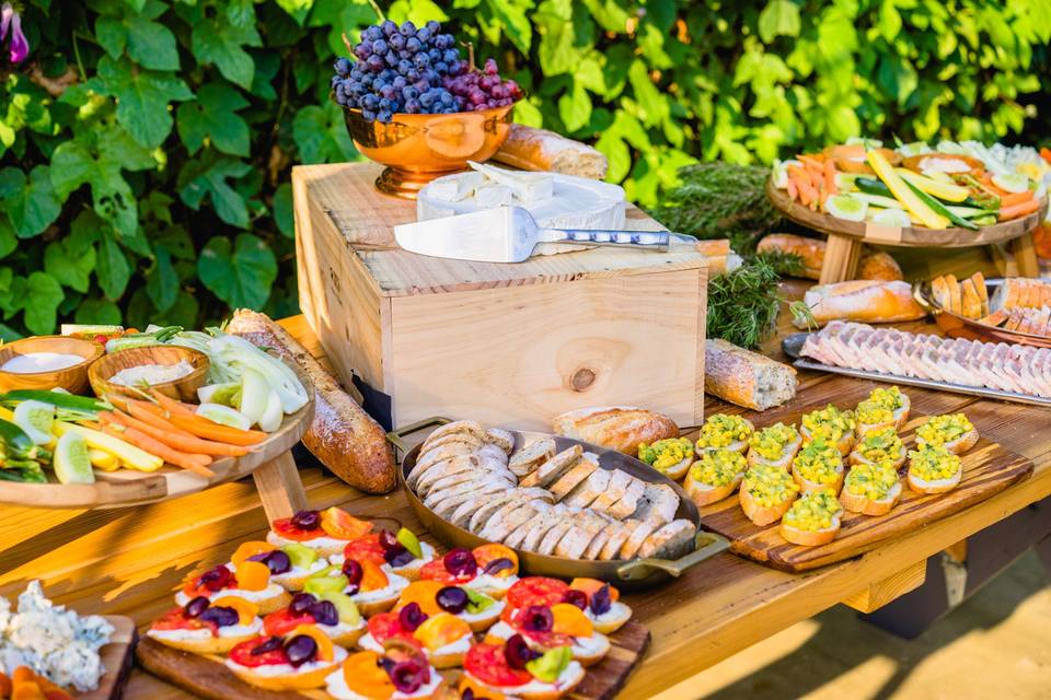 A stationary table for a Los Angeles wedding we did at Ruby Street (a gorgeous venue). Also on the table: heirloom tomato toast with homemade ricotta and pickled cherries, elotes toast, two crudité platters (all from the Santa Monica farmer's market), country pâté and a selection of local cheeses paired with homemade jams.
