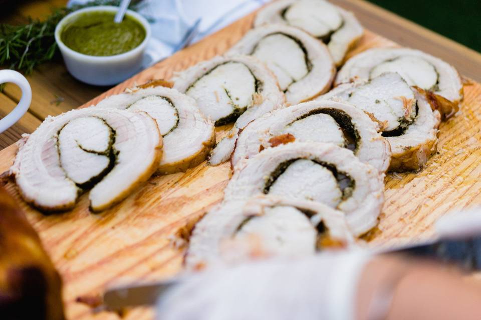 Roasted porchetta entree for a Los Angeles wedding buffet (action station with a chef carving the meat for guests).