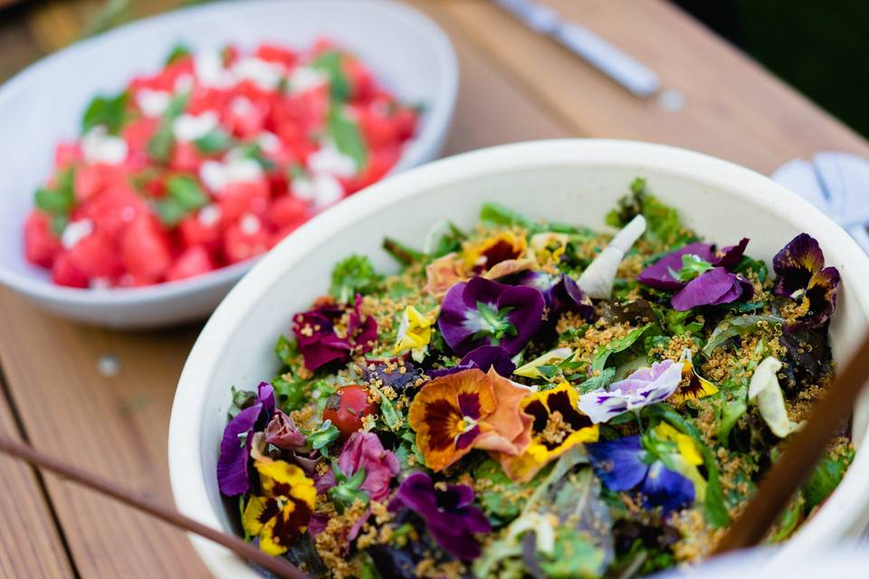 Watermelon salad with goat cheese and mint, and a market green salad with fennel, cherry tomatoes, crispy quinoa, basil, mint and an herb vinaigrette.