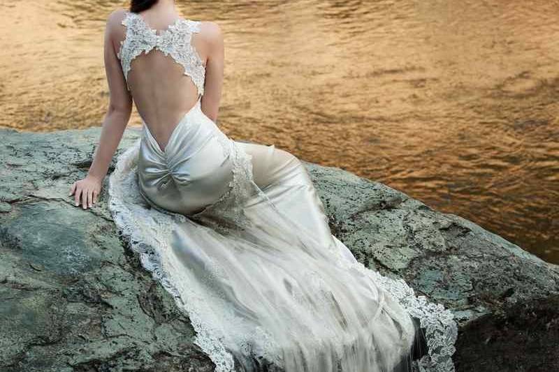 Spring 2014 AddisonLow back mermaid gown made from crepe-back silk satin. Re-embroidered Alençon lace creates a deep V neckline and a double clamshell back, as well as flattering appliques on the hip and an intricate scallop on the hem of the gown and removable train.