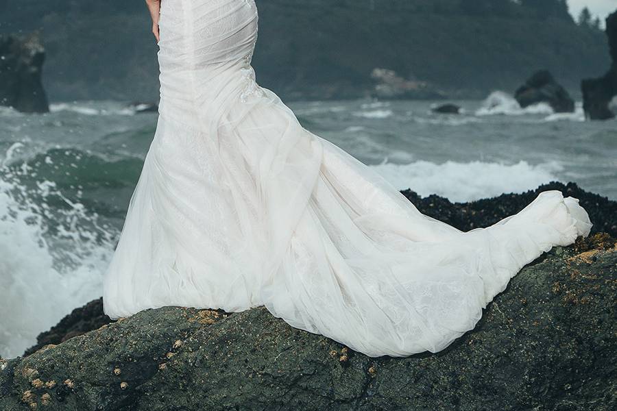 BerkeleySweetheart strapless mermaid gown with a dramatic full skirt and airy bubble hem. Blush tulle is ruched over a light Ivory French Chantilly lace underlay. Italian embroidery appliqué draws attention to the small waist created by a sheer organza corset inside.