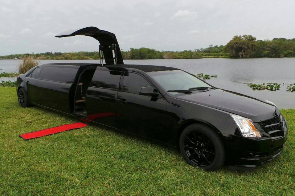 Black limo by the sea