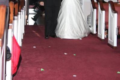 Bride and father entering church.