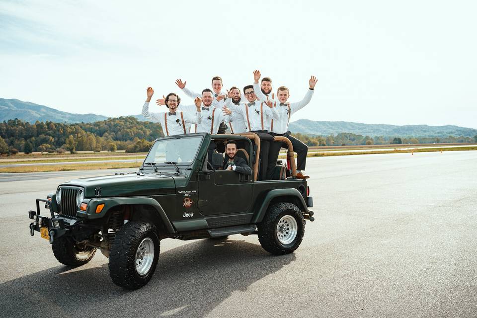 Groomsmen hanging out in Jeep