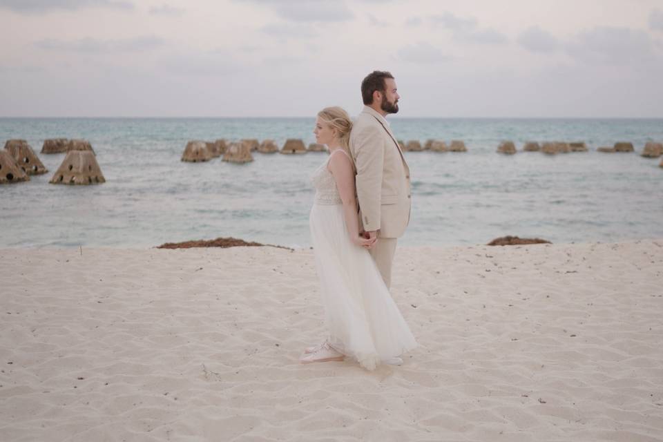 Bride and groom on beach