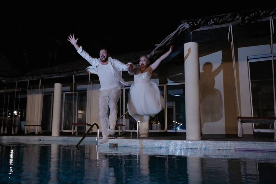 Jumping into pool at reception