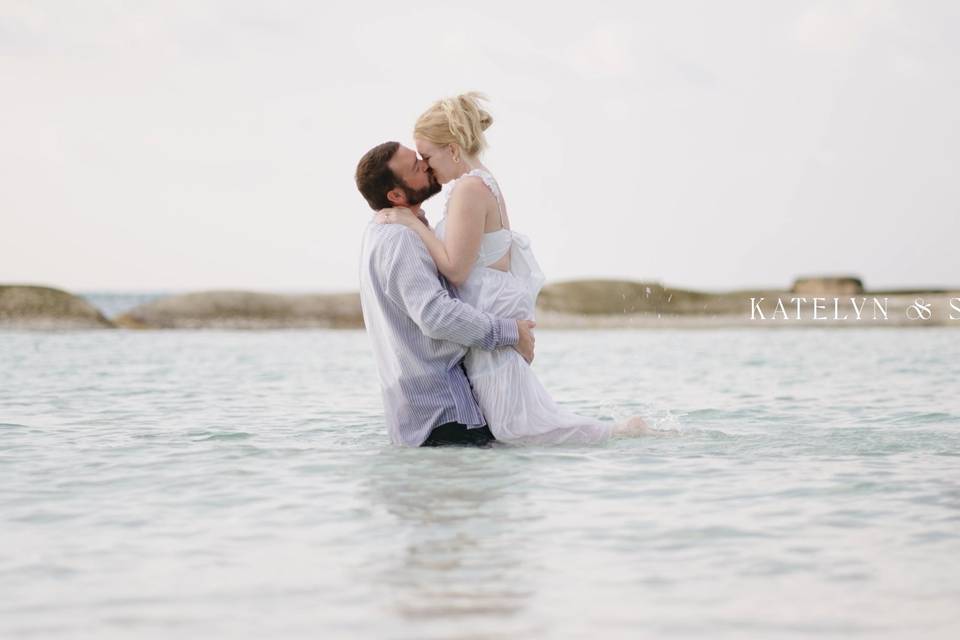 Couple kissing in the ocean