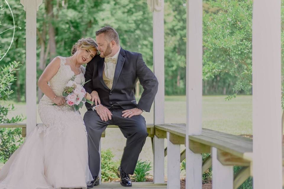 Couple poses under Gazebo