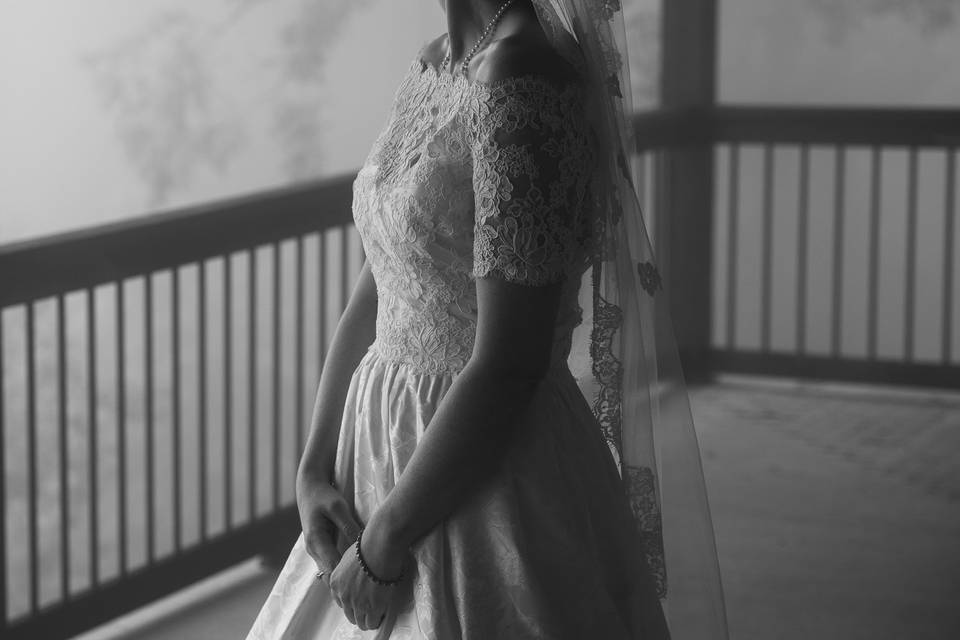 Bride in dress in the fog