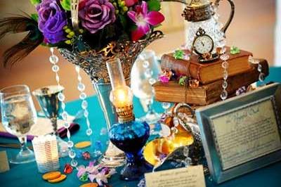 Wedding table centerpiece with books, antique silver and oil lamp