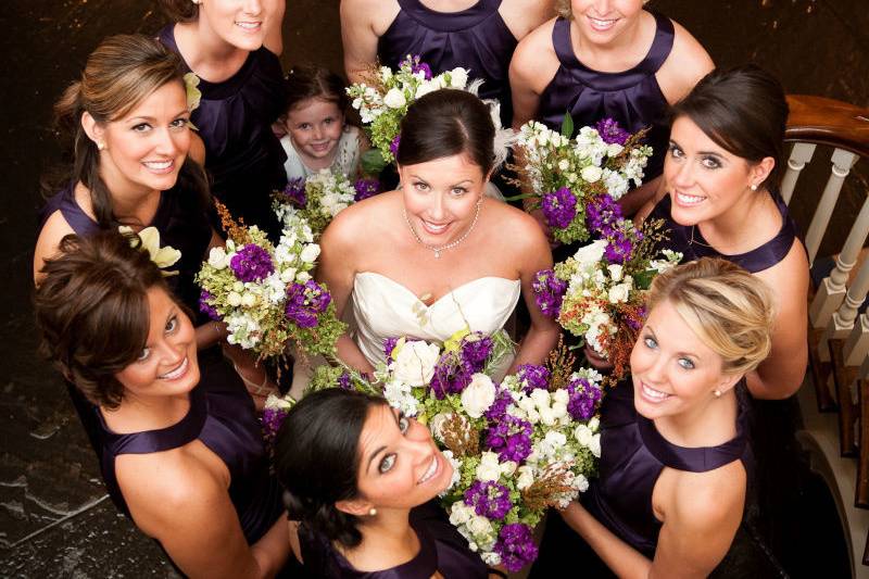 Bridesmaids around their bride