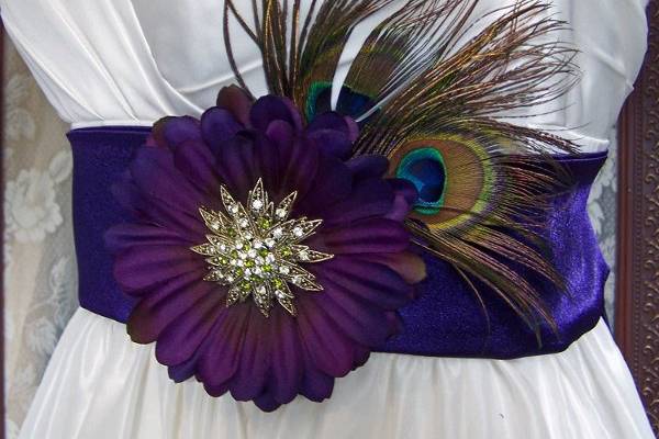 Stunning Purple Satin belt with Purple Gerbera Daisy accented with Peacock feather and Large Antique brooch. Each brooch will be different.