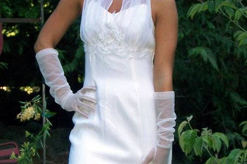 White Crepe dress with sheer bust halter, edged in beadwork.