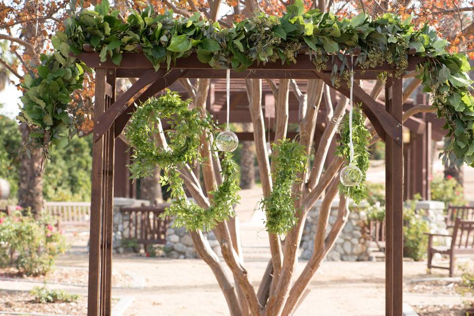 An arbor of gorgeous greenery at Citrus Park Wedding Venue in Riverside, CA.