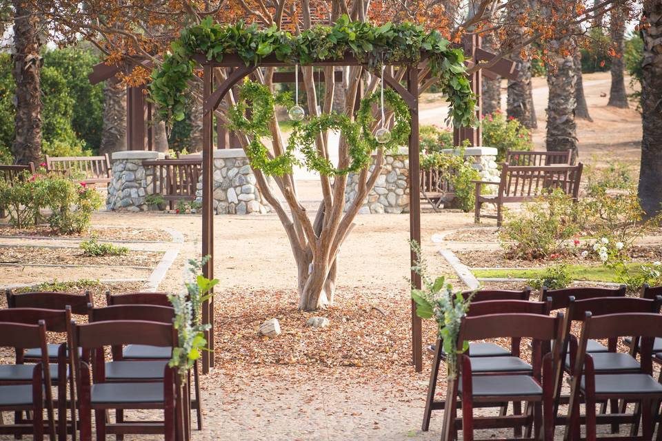 A Summer ceremony set up at Citrus Park Wedding Venue in Riverside, CA.