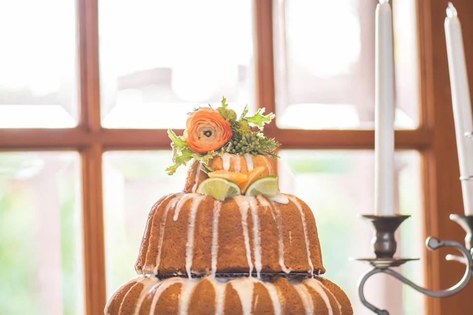 An iced orange wedding bundt cake at Citrus Park Wedding Venue in Riverside, CA.
