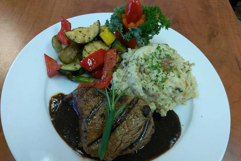 Plated tasting with fillet risotto and vegetables