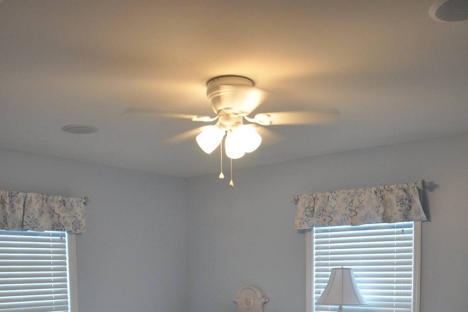 Upstairs bedroom with a two twin beds and shared bath with tub and shower.