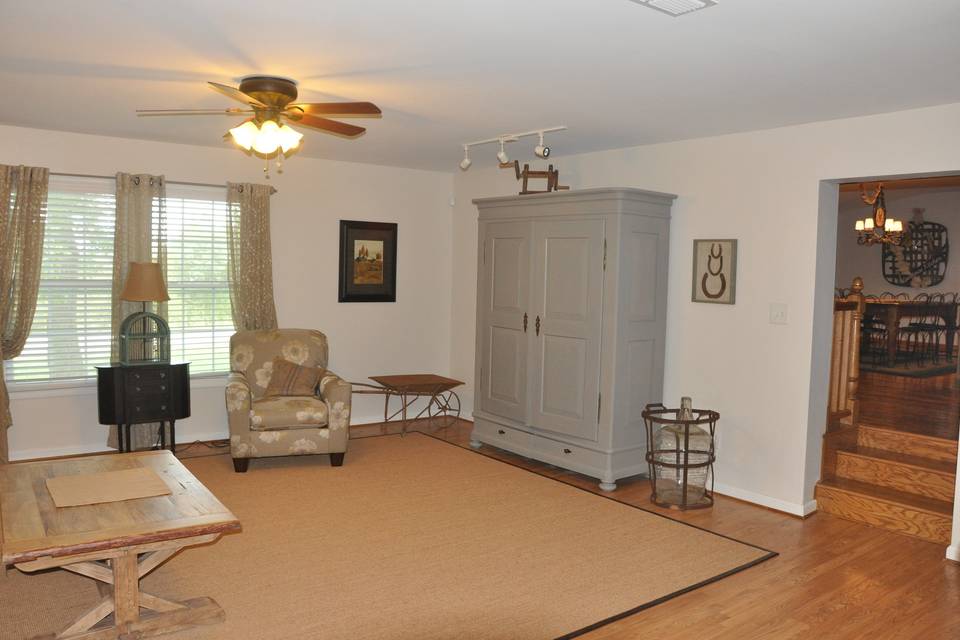 Second view of Guest House family gathering space with media center inside armoire