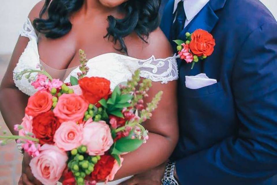 This couple is showing off their his and her flowers at The amazing Church Street Venue.