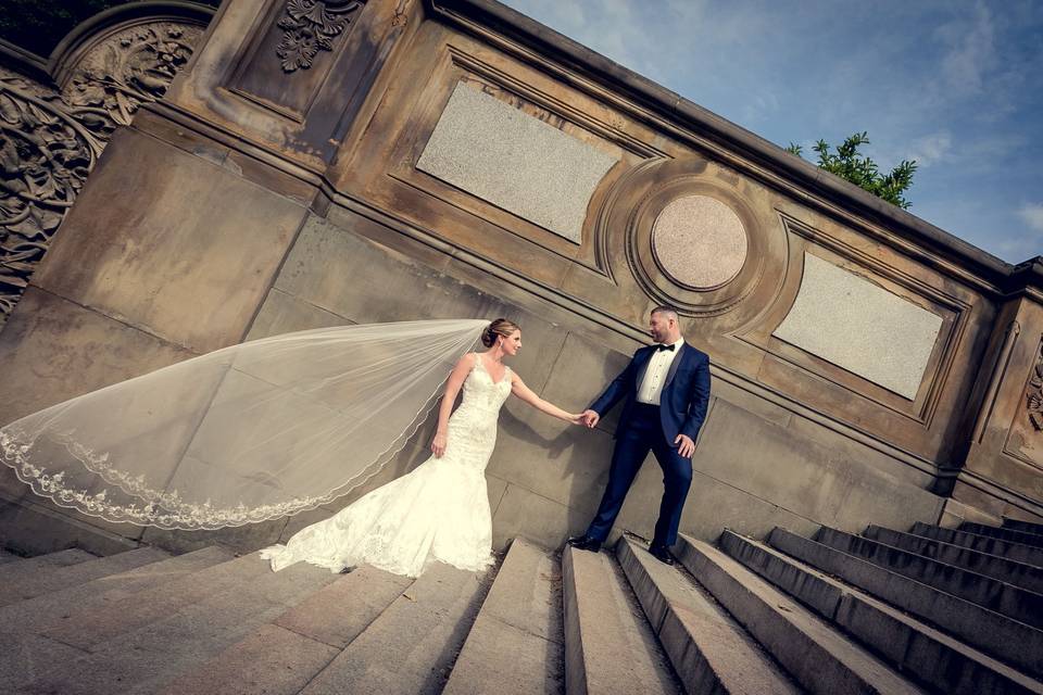 Holding hands on the stairs - Gary Flom Wedding Photography