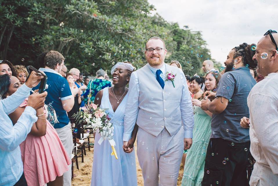 Guests cheering for the newlyweds