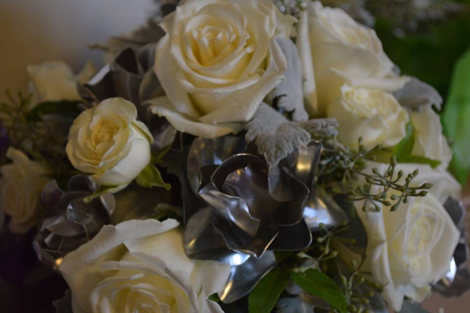 The bride made the metal roses from sheet metal! They were stunning!