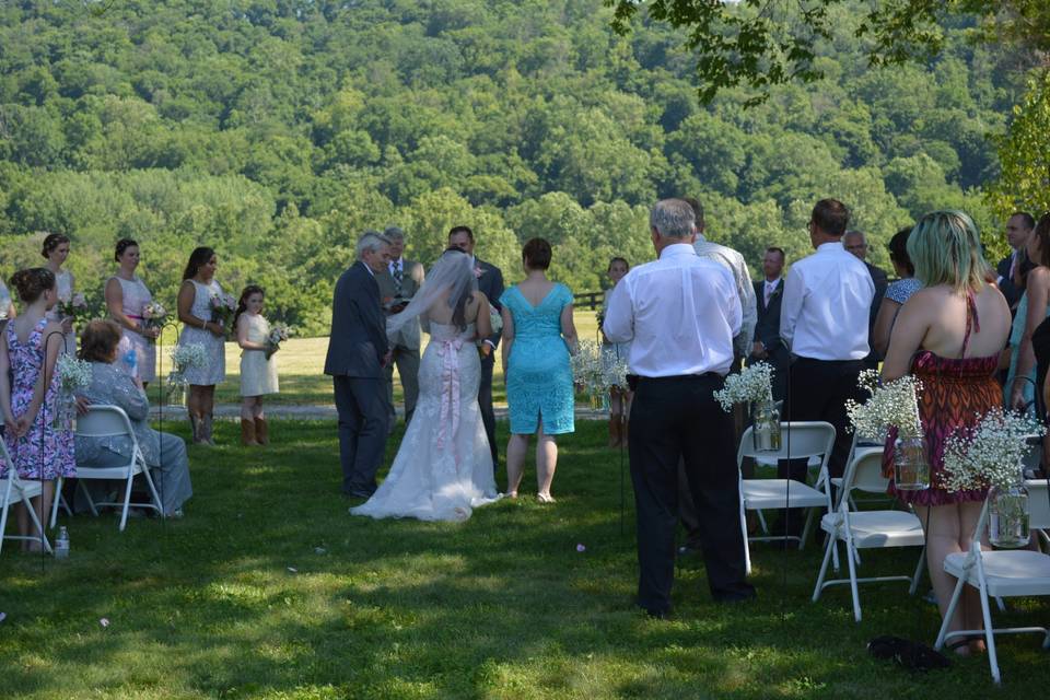 Both parents of the bride walked her down the aisle