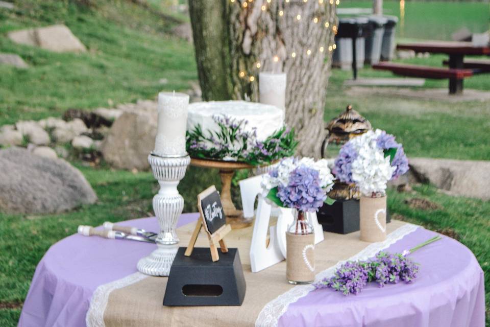 Cake table for a rustic outdoor reception.