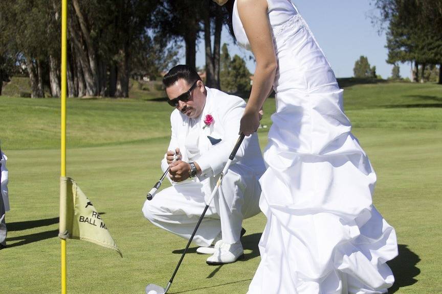 The couple playing golf