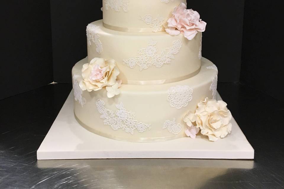 Ivory Wedding Cake with Lace Appliques and Sugar Roses