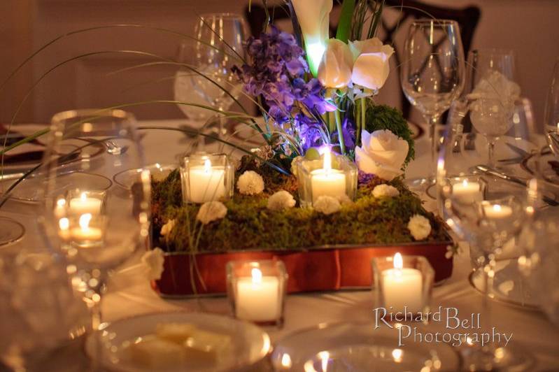 Table setting with floral and candle centerpiece