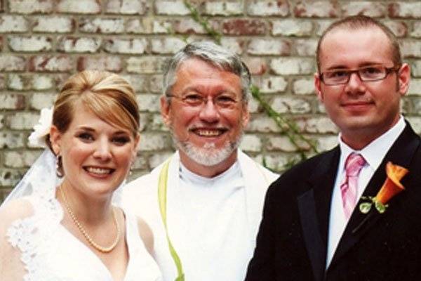 The officiant and the newlyweds