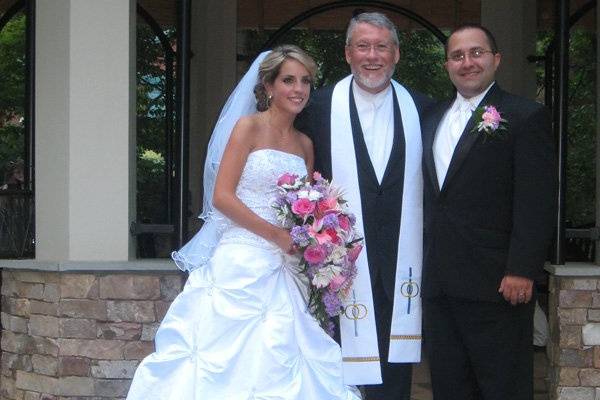 The newlyweds and the officiant