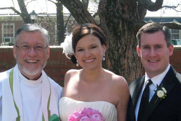 The newlyweds and the officiant