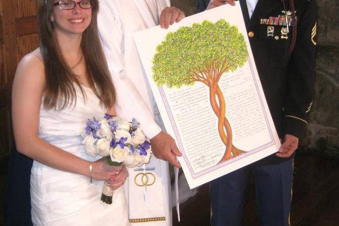 The newlyweds and the officiant