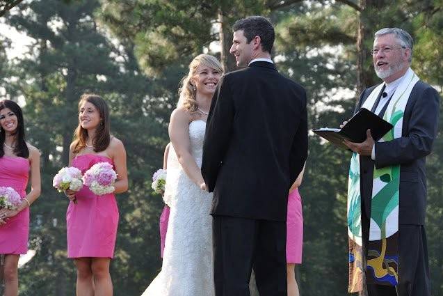 The officiant and the newlyweds