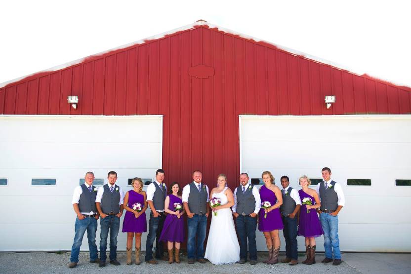 The couple with the bridesmaids and groomsmen