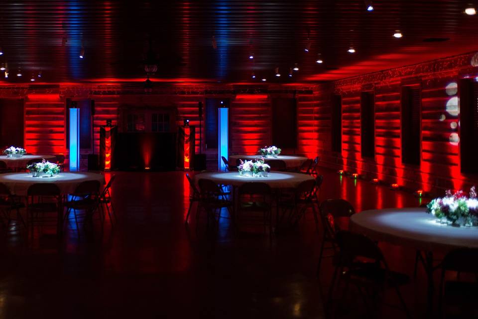 Red uplighting and floral pinspot lighting