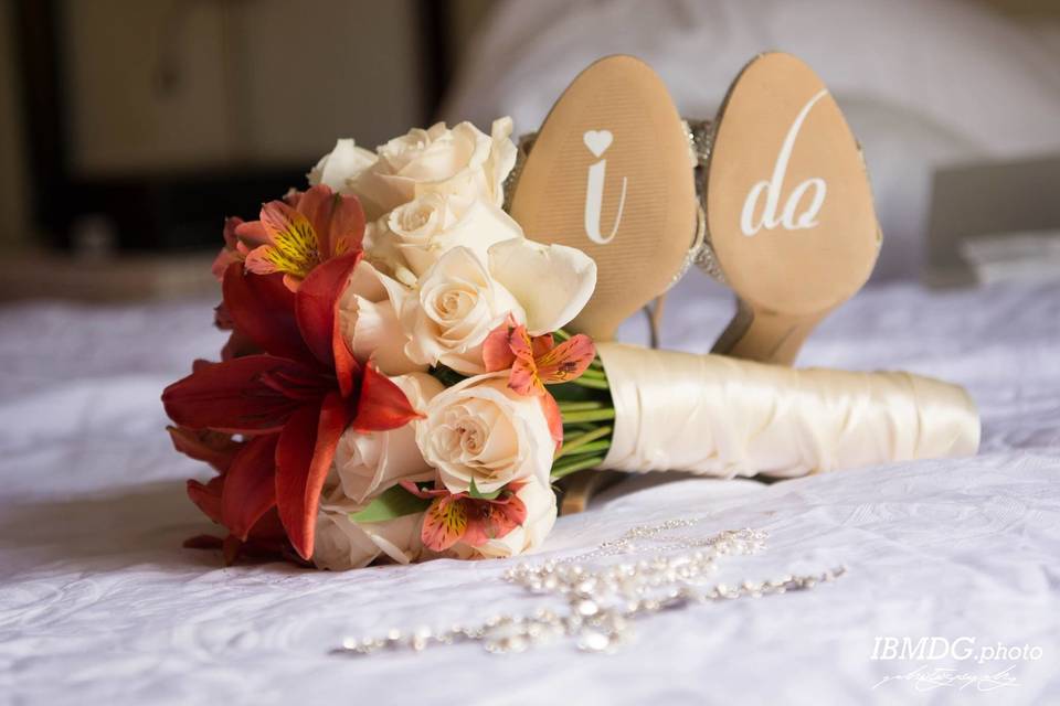 Bridal shoes and her bouquet