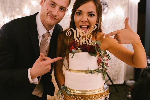 Couple and their wedding cake
