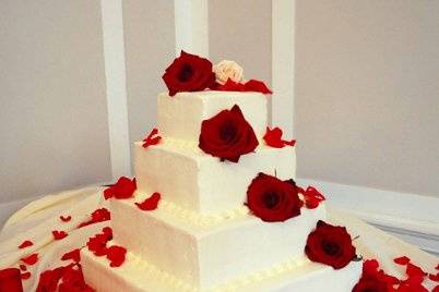 The Wedding Cake... Decorated w/ Fresh Red Roses & Petals!