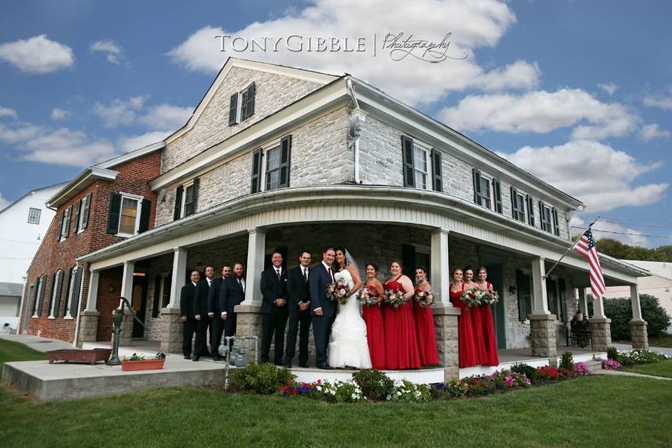 The couple with the bridesmaids and groomsmen