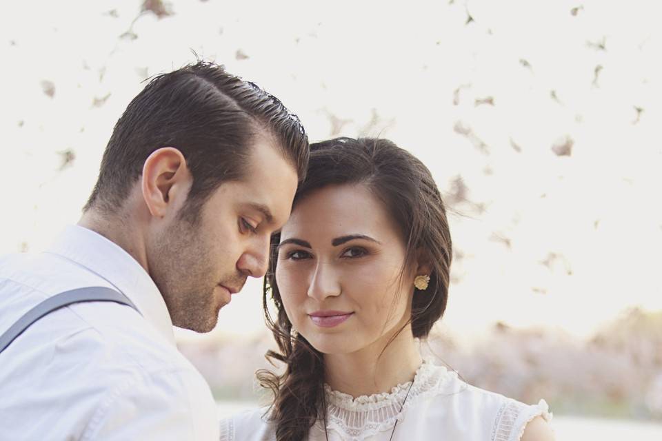 Groom with bride holding a bouquet