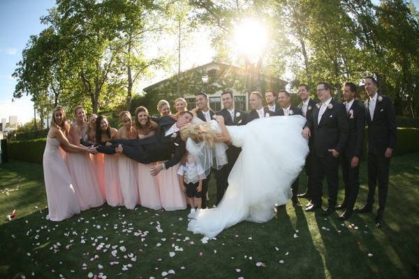 The couple with the bridesmaids and groomsmen