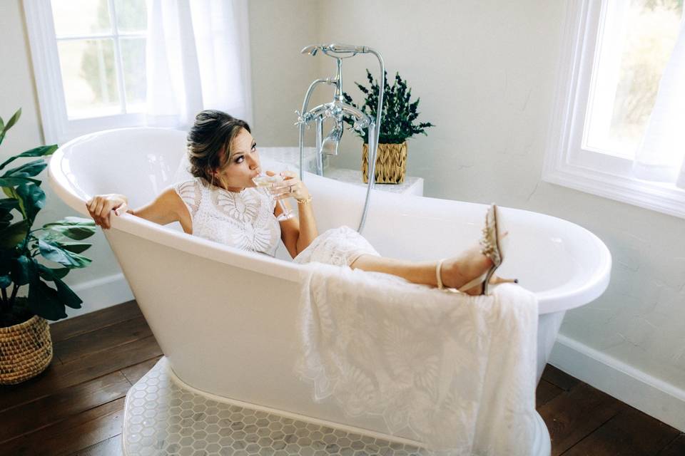 Bride posing in tub