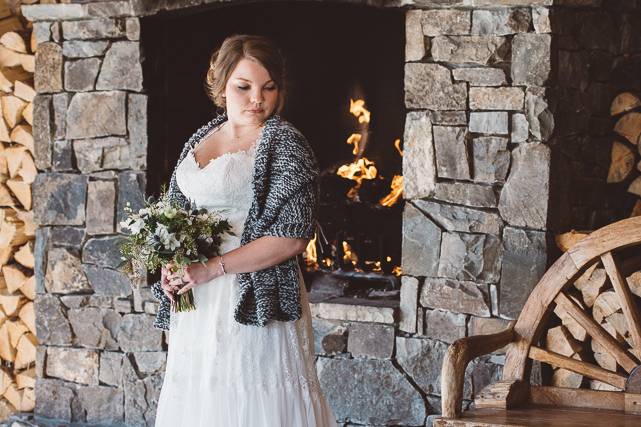 Bride by fireplace