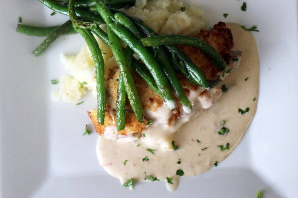 Chicken Irene with homemade mashed potatoes and crispy green beans.