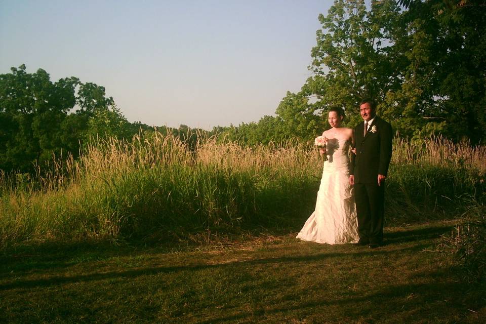 Bride and her father, walking down the countryside aisle