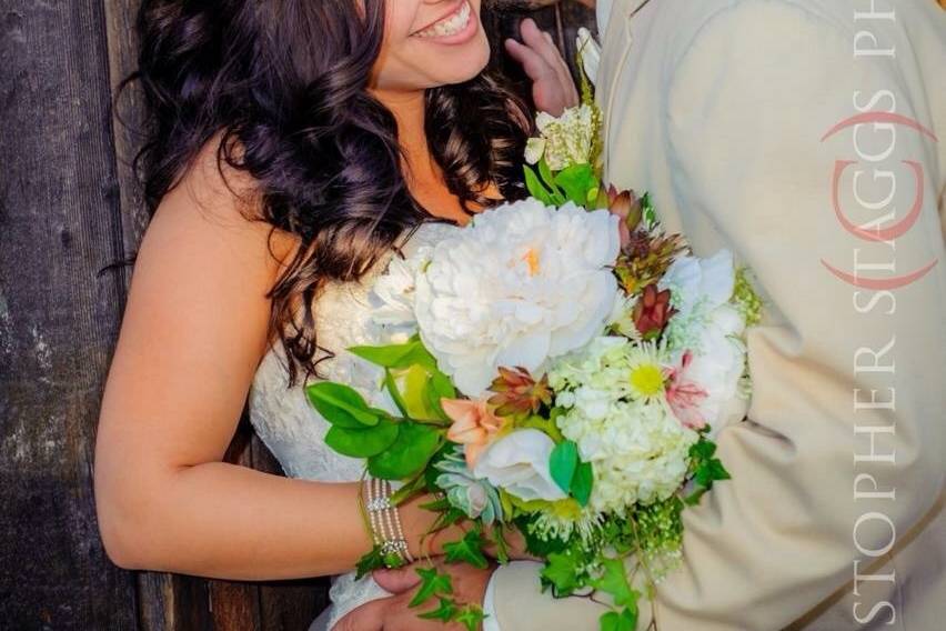 Groom giving his bride a kiss
